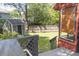 View of backyard with shed and fenced perimeter from the covered outdoor space at 152 Mansfield Blvd, Charleston, SC 29418