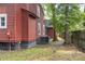 The backyard features mature trees and a wooden fence for privacy at 152 Mansfield Blvd, Charleston, SC 29418