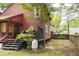 A peaceful backyard with a wooden fence, lush greenery, and manicured lawn at 152 Mansfield Blvd, Charleston, SC 29418