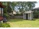 This expansive backyard features a storage shed, a luscious garden, and a stairway leading to the back entrance at 152 Mansfield Blvd, Charleston, SC 29418