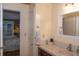 Bright bathroom with a tile countertop, warm-toned walls, and a glimpse into a bedroom at 152 Mansfield Blvd, Charleston, SC 29418