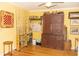 This room has fishing decor, rods, and tackle and features hardwood flooring and a vintage wooden cabinet at 152 Mansfield Blvd, Charleston, SC 29418