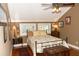 A cozy bedroom with a ceiling fan, unique wall art, and lots of natural light at 152 Mansfield Blvd, Charleston, SC 29418