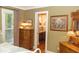 Bedroom with dresser, natural light, and ensuite bathroom featuring a sink and vanity at 152 Mansfield Blvd, Charleston, SC 29418