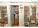 Inviting entryway with wood floors, a partial view of stairs, and a bright sunroom at 152 Mansfield Blvd, Charleston, SC 29418