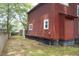 Exterior shot of the house showing skirting around the foundation and white trimmed windows at 152 Mansfield Blvd, Charleston, SC 29418