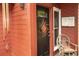 Charming front door and adjacent vintage chair with a 'For Sale' sign, next to a window at 152 Mansfield Blvd, Charleston, SC 29418