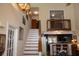 Bright interior view featuring a staircase, gallery, and open-concept living space with access to the kitchen at 152 Mansfield Blvd, Charleston, SC 29418