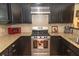 Stainless steel appliances, granite countertops, and dark wood cabinetry at 152 Mansfield Blvd, Charleston, SC 29418