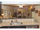 Open-concept view from kitchen countertop to a well-lit living area with a fireplace and ample natural light at 152 Mansfield Blvd, Charleston, SC 29418