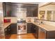 The kitchen features stainless steel appliances, granite countertops, black cabinetry and tile backsplash at 152 Mansfield Blvd, Charleston, SC 29418