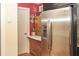 Cozy kitchen boasts stainless refrigerator and custom cabinets at 152 Mansfield Blvd, Charleston, SC 29418