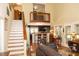 Spacious living room with staircase, loft, open access to the kitchen and ample seating at 152 Mansfield Blvd, Charleston, SC 29418