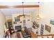 Open living room with hardwood floors, fireplace, and ceiling fan under vaulted ceilings at 152 Mansfield Blvd, Charleston, SC 29418