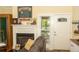 Comfortable living room with fireplace and door to porch in a well-lit setting at 152 Mansfield Blvd, Charleston, SC 29418