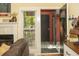 Living room with fireplace, mantel decorations, and view of door to porch at 152 Mansfield Blvd, Charleston, SC 29418