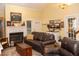 Relaxing living room with a fireplace, comfortable seating, and natural light at 152 Mansfield Blvd, Charleston, SC 29418