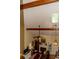 Bright living room featuring vaulted ceilings with exposed beams, a ceiling fan, and a cozy fireplace at 152 Mansfield Blvd, Charleston, SC 29418