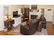 Inviting living room with hardwood floors, fireplace, and comfortable seating arrangement at 152 Mansfield Blvd, Charleston, SC 29418
