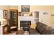 Cozy living room featuring a fireplace, wood floors, and comfortable seating at 152 Mansfield Blvd, Charleston, SC 29418