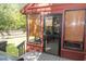 Covered porch features windows with blinds and an exterior door with black frame at 152 Mansfield Blvd, Charleston, SC 29418