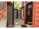 Patio entrance featuring a black front door with a wreath and an outdoor shower at 152 Mansfield Blvd, Charleston, SC 29418