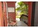 Charming front porch with vintage chair, adjacent to a 'For Sale' sign at 152 Mansfield Blvd, Charleston, SC 29418
