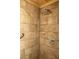 Spacious shower with stylish tile, rainfall showerhead, and convenient glass shelving at 152 Mansfield Blvd, Charleston, SC 29418