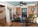 Charming sunroom featuring wicker furniture, bamboo shades, and a clock, creating a cozy retreat at 152 Mansfield Blvd, Charleston, SC 29418
