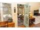 Bright sunroom with charming decor, wood floors, and a cozy atmosphere for relaxing or entertaining at 152 Mansfield Blvd, Charleston, SC 29418