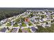 Aerial view of a beautiful lakeside community with well-maintained homes and lush greenery at 173 Southport Dr, Summerville, SC 29483