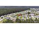 Community aerial view showing a house with a pond, surrounded by trees and other residential homes at 173 Southport Dr, Summerville, SC 29483