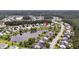 Overhead view of a peaceful neighborhood surrounding a tranquil lake, showcasing lovely houses at 173 Southport Dr, Summerville, SC 29483