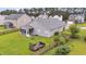 Spacious backyard featuring a screened porch, lush green lawn, and a wooden fence, perfect for outdoor enjoyment at 173 Southport Dr, Summerville, SC 29483
