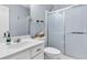 This bright bathroom has a shower with sliding glass doors and a vanity with ample storage at 173 Southport Dr, Summerville, SC 29483