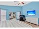 Comfortable bedroom with blue walls, a ceiling fan, stylish furniture, and natural light at 173 Southport Dr, Summerville, SC 29483
