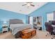 Comfortable bedroom with blue walls, a ceiling fan, stylish furniture, and natural light at 173 Southport Dr, Summerville, SC 29483
