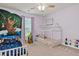 Charming ' bedroom features playful wall art, twin beds, and whimsical decor for a creative space at 173 Southport Dr, Summerville, SC 29483