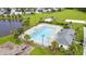 Overhead view of large pool with lounge chairs and umbrellas with a playground nearby at 173 Southport Dr, Summerville, SC 29483