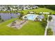 Aerial of community pool, playground, and surrounding green space in the neighborhood at 173 Southport Dr, Summerville, SC 29483