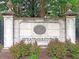 Elegant entrance to Weatherstone community featuring a stone sign surrounded by greenery at 173 Southport Dr, Summerville, SC 29483