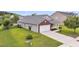 Charming home featuring a well-maintained lawn, attached garage, and a classic brick-and-siding facade at 173 Southport Dr, Summerville, SC 29483