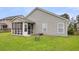 Home exterior featuring a screened-in porch and a well-maintained backyard with lush green grass at 173 Southport Dr, Summerville, SC 29483