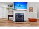 Elegant fireplace with decorative ironwork, built-in shelves, creating a cozy focal point at 173 Southport Dr, Summerville, SC 29483