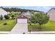 Classic home with a well-manicured front lawn, brick accents, an attached garage, and a welcoming front porch at 173 Southport Dr, Summerville, SC 29483