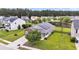 Aerial view of a charming home with a well-kept lawn, solar panels, a brick facade, and an attached garage at 173 Southport Dr, Summerville, SC 29483