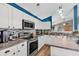 Bright kitchen featuring stainless steel appliances, mosaic backsplash, and modern lighting at 173 Southport Dr, Summerville, SC 29483