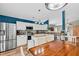 Bright eat-in kitchen with stainless steel appliances, mosaic backsplash, and stylish modern lighting at 173 Southport Dr, Summerville, SC 29483