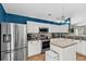 Bright eat-in kitchen with stainless steel appliances, mosaic backsplash, and stylish modern lighting at 173 Southport Dr, Summerville, SC 29483