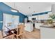 Bright kitchen with modern appliances, a central island, and an adjacent dining area at 173 Southport Dr, Summerville, SC 29483